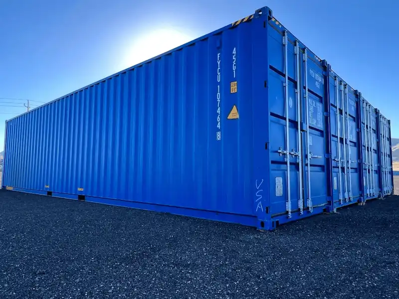 Pristine blue 40ft high cube shipping container sitting on gravel, ready for transport, symbolizing a valuable investment asset.
