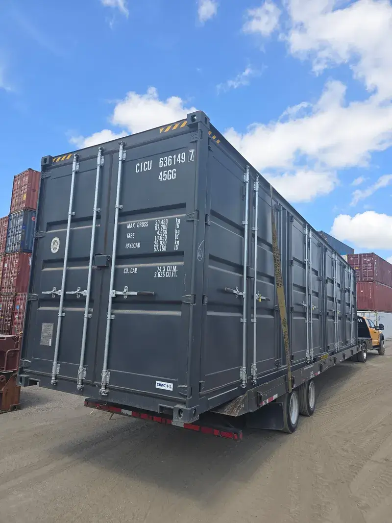 40'ft High Cube Open Side Container on a tilt-bed trailer