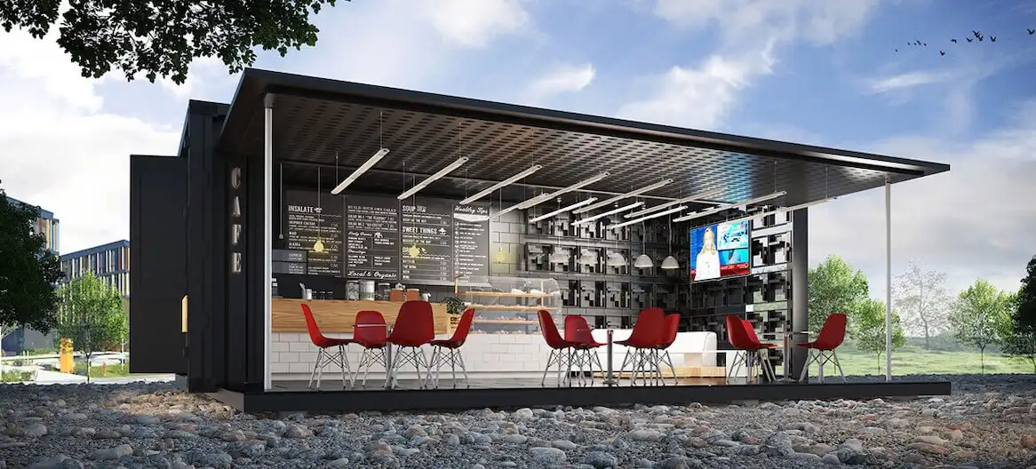 Modern black shipping container cafe with a large awning, outdoor seating, and menu boards, demonstrating retail customization.