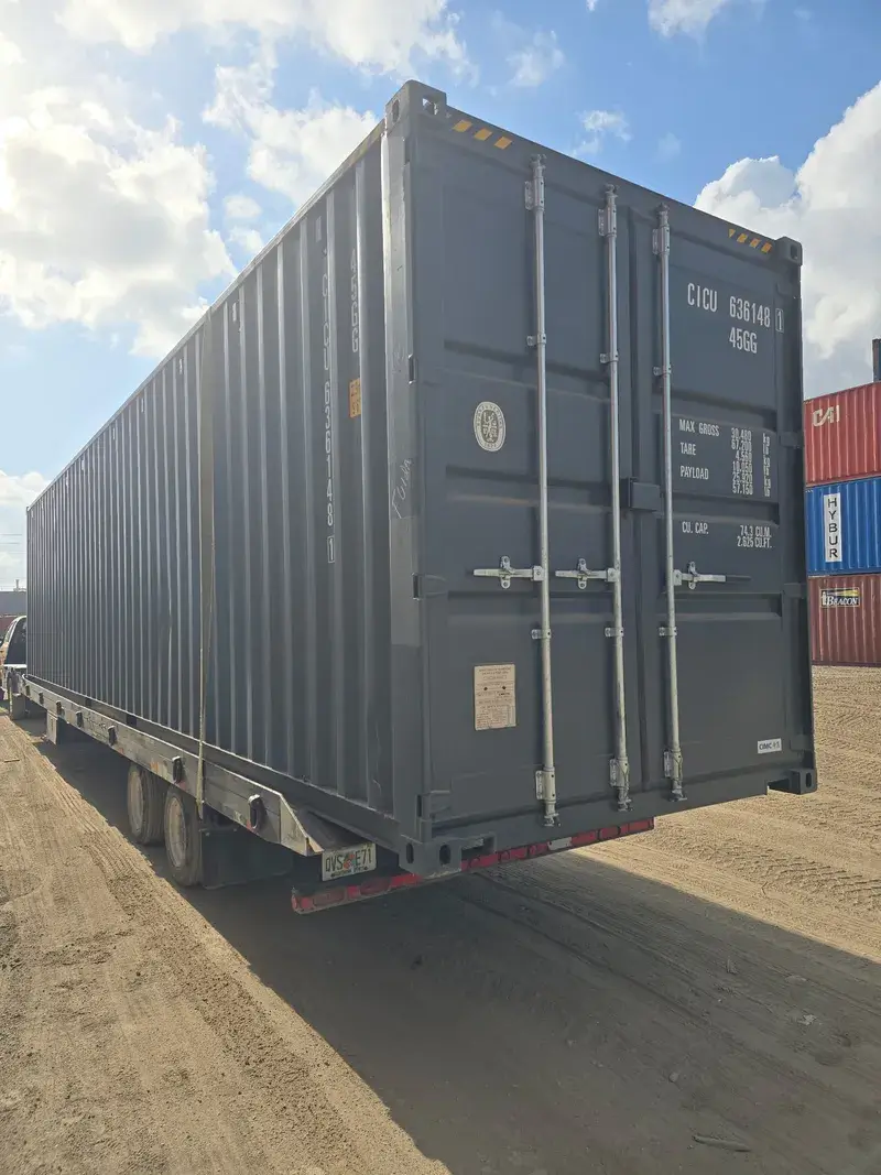 40'ft High Cube Open Side Container on a tilt-bed trailer