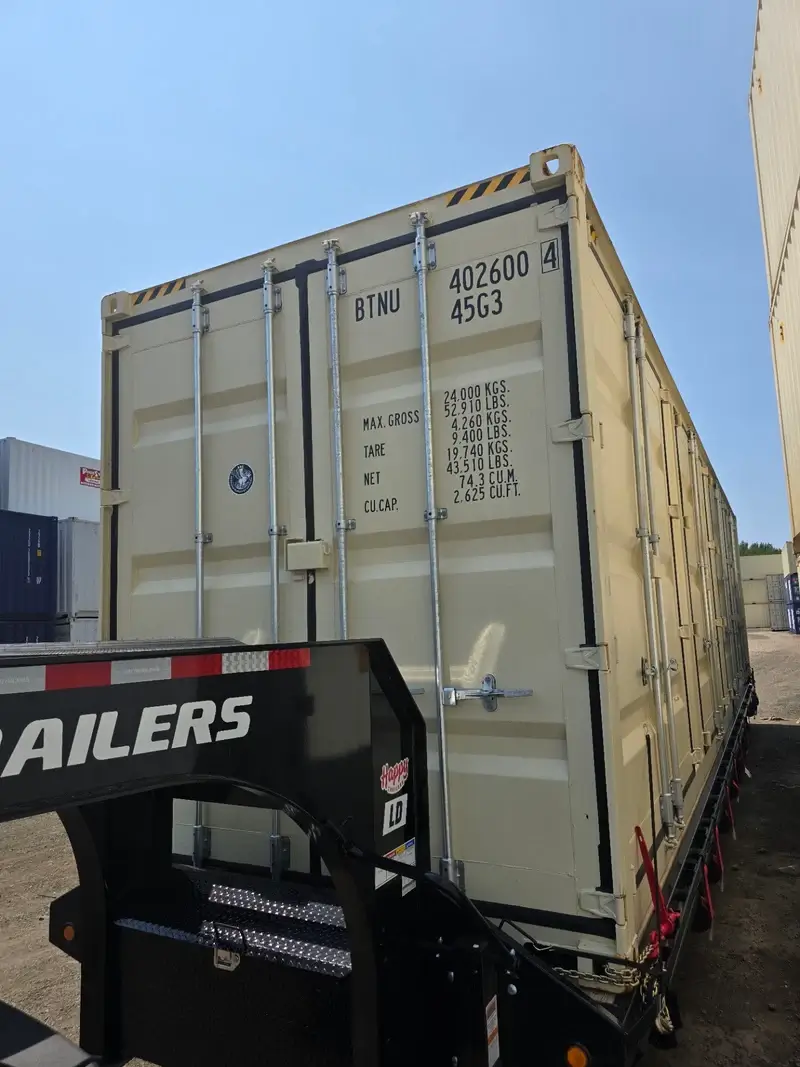 A 40ft high cube open-side shipping container with four doors, for sale and being delivered in Taunton, MA.